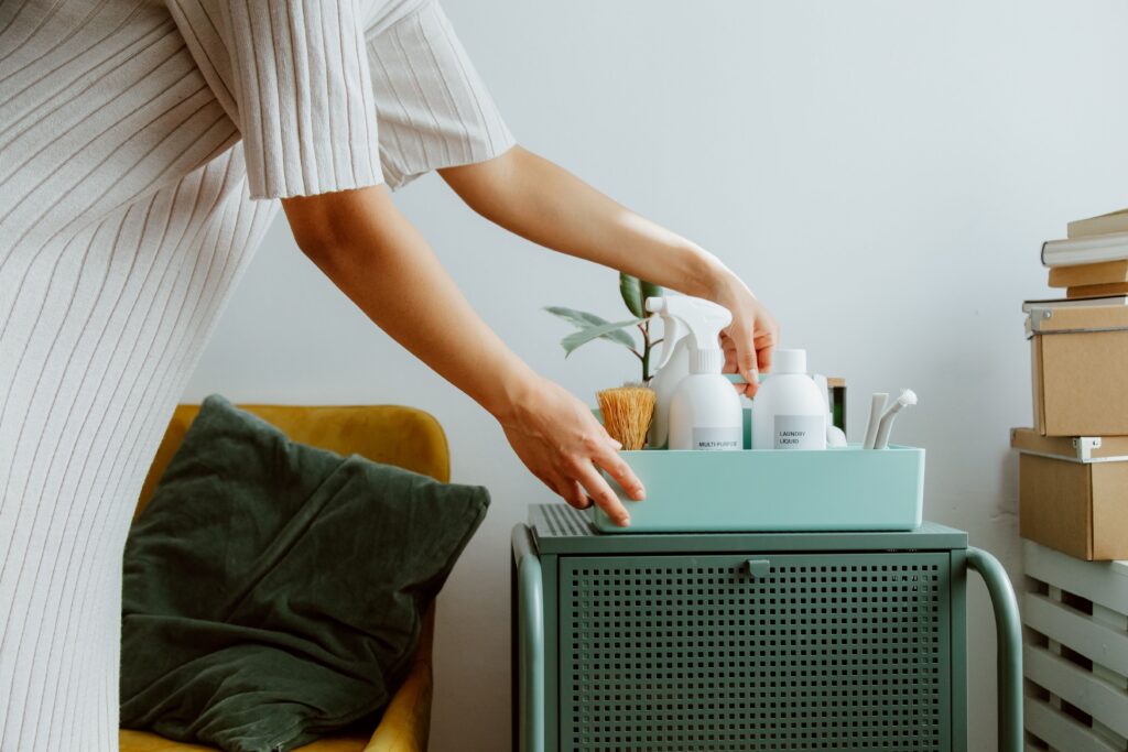 pexels-photo-10557500-10557500 A woman organizes self-care products in a stylish room, embodying minimalism and tranquility.