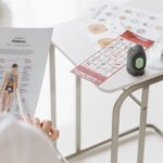 Close-up of diabetes management tools and educational materials on a table.